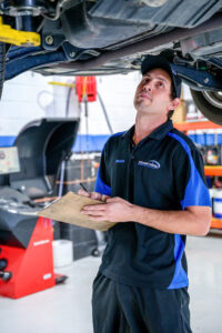 Coastwide Service Centre car mechanic checking the car's condition for roadworthy certificate qld aka rwc and logbook service.