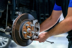 Coastwide Service Centre mechanic in the middle of brake repair and brake pads replacement